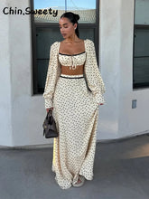 Charger l'image dans la galerie, Ensemble mode pour femme : jupe longue à pois et haut court en dentelle (encolure carrée, manches ballon) ; jupe trapèze taille haute. Tenue d'été 2026.
